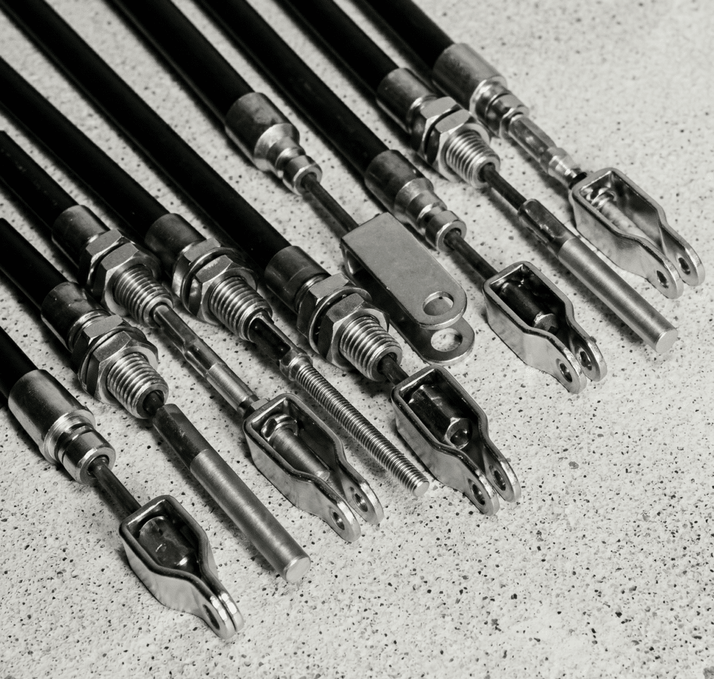 An image of brake cables piled up in white background